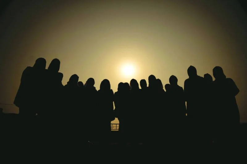 A group of Afghan women prosecutors stand during sunrise in Islamabad, as they wait for their asylum requests to be addressed after fleeing Afghanistan fearing persecution by the Taliban government, in this picture taken September 22.