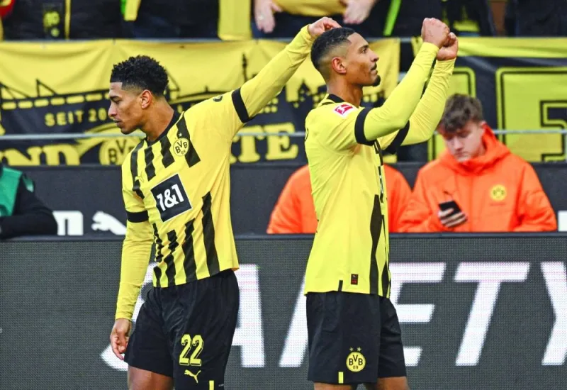 Dortmund’s Sebastien Haller (right) celebrates with teammate Jude Bellingham after scoring against SC Freiburg in Dortmund, Germany, yesterday. (AFP)