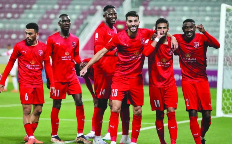 Al Duhail’s Sultan al-Brake (second right) celebrates with teammates after scoring against Al Ahli on Saturday. 