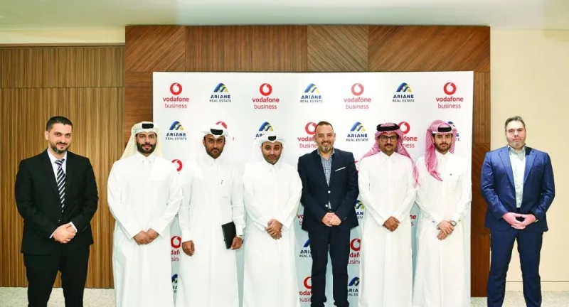 Representatives from Vodafone Qatar and Ariane Real Estate during the MoU signing ceremony.