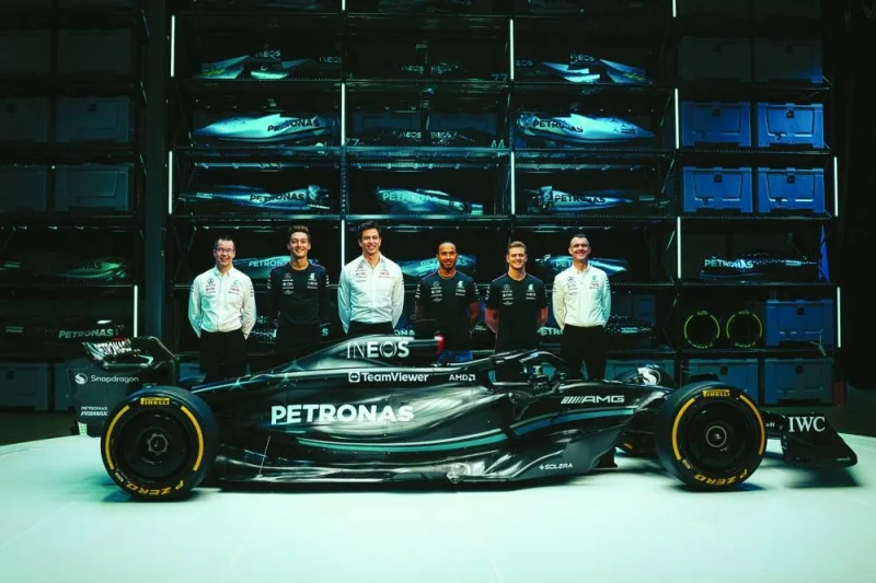 Mercedes shows the team’s British driver George Russell (second from left), Team principal Toto Wolff (third from left), British driver Lewis Hamilton (third from right) and reserve driver Mick Schumacher (second from right) posing with their new Mercedes-AMG F1 W14 E Formula One racing car during their 2023 season launch in Silverstone on Wednesday. (AFP)