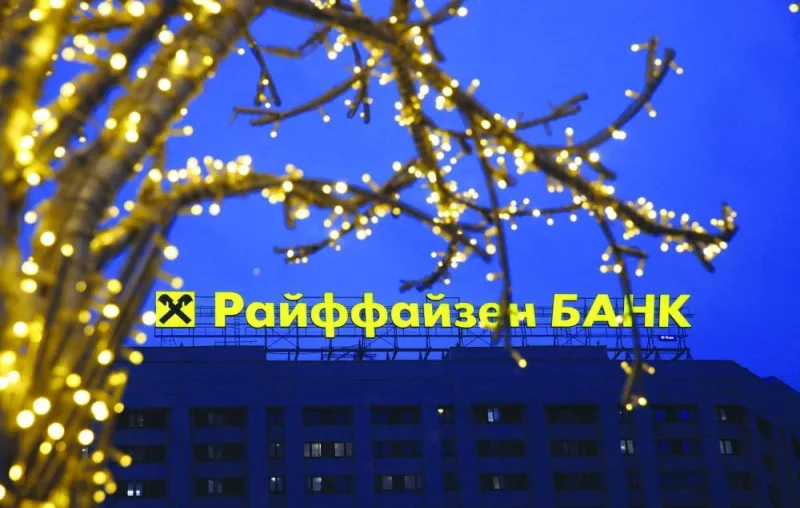 A signboard advertising Raiffeisen Bank behind an illuminated installation in Moscow earlier this month.  (Reuters)
