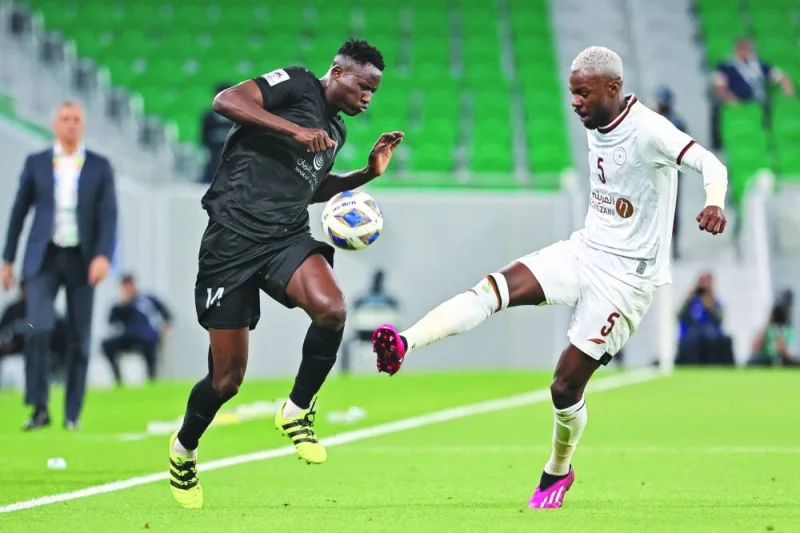 Duhail&#039;s Kenyan forward Michael Olunga (L) is marked by Shabab&#039;s Saudi defender Hassan Tambakti during the AFC Champions League quarter-final football match between Qatar&#039;s Al-Duhail and Saudi Arabia&#039;s Al-Shabab at the Al-Thumama Stadium in Doha on February 23, 2023.