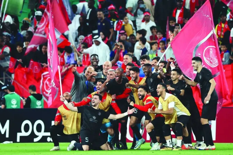 Duhail&#039;s players celebrate with their supporters after the AFC Champions League quarter-final football match between Qatar&#039;s Al-Duhail and Saudi Arabia&#039;s Al-Shabab at the Al-Thumama Stadium in Doha on February 23, 2023. 