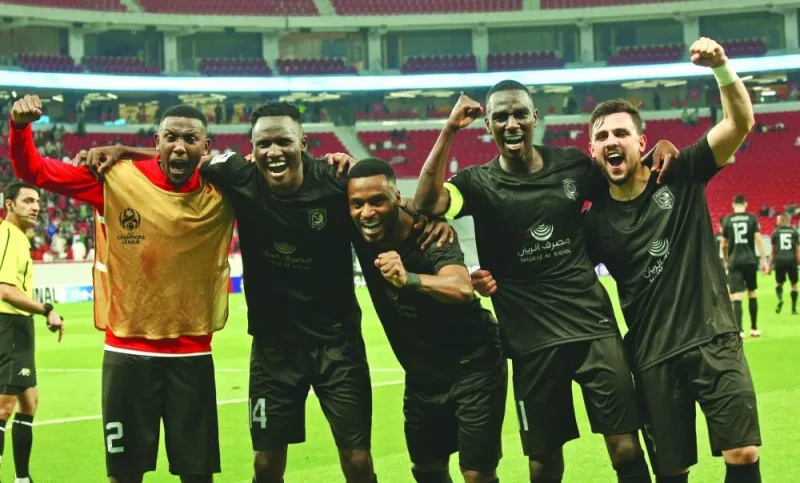 Al Duhail’s Michael Olunga (second left) celebrates with teammates after the Qatar club defeated Al Shabab in the AFC Champions League quarter-finals on Thursday.
