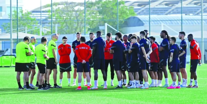 Al Duhail coach Hernan Crespo (fifth left) talks to his players before a training session yesterday, on the eve of their AFC Champions League semi-final against Al Hilal. 