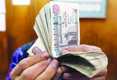 An employee counts Egyptian pounds at a foreign exchange office in central Cairo. The 00bn economy — one of the world’s top wheat importers — is under increasing pressure from the shockwaves of Russia’s invasion of Ukraine, which sent food and fuel prices soaring.