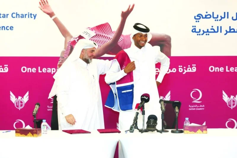 QC CEO Yousuf bin Ahmed al-Kuwari and Qatari champion high jumper Mutaz Barshim at the cerem