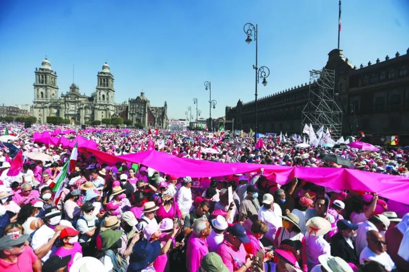 People take part in a protest in support of the National Electoral Institute and against President Andres Manuel Lopez Obrador’s plan to reform the electoral authority, in Mexico City on Sunday. 