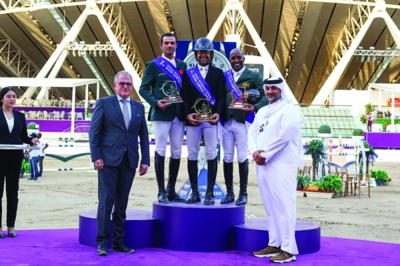 Grand Prix podium winners of the Doha International Showjumping Championship pose with Qatar Equestrian Federation’s technical director and former Olympic rider Ali Yousef al-Rumaihi (right) and president of the ground jury Stephan Ellenbruch at Al Shaqab yesterday.