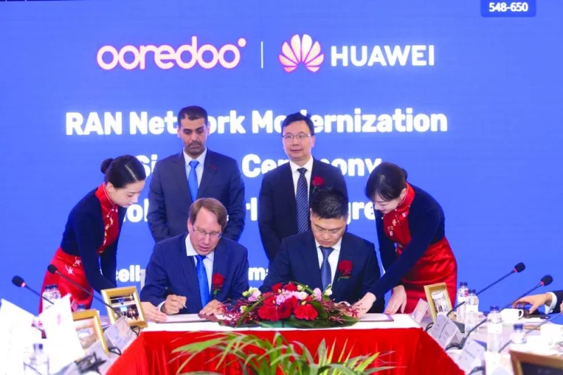 Ooredoo and Huawei officials at the new co-operation agreement signing at the Mobile World Congress 2023 in Barcelona.