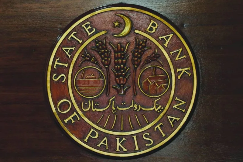 A logo of the State Bank of Pakistan is pictured on a reception desk at the head office in Karachi. The SBP had brought forward its policy meeting from an original date of March 16, with local media saying the rate hike was a key requirement to get the IMF funding released.
