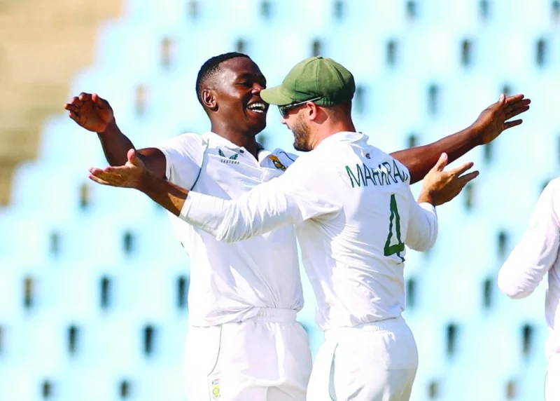 South Africa’s Kagiso Rabada celebrates with Aiden Markram after taking the wicket of West Indies’ Jermaine Blackwood on the third day of the first Test in Centurion on Thursday. (AFP)