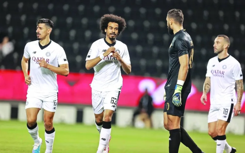 Al Sadd’s Akram Afif (centre) celebrates after scoring against Al Sailiya during the QNB Stars League on Friday. 