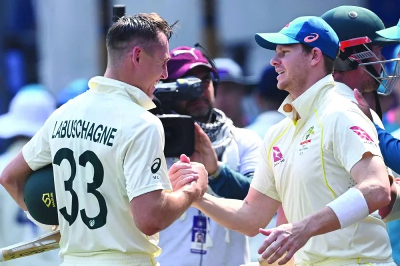 Australia’s stand-in captain Steve Smith (right) celebrates with his teammate Marnus Labuschagne at the Holkar Stadium in Indore on Friday. (AFP) 