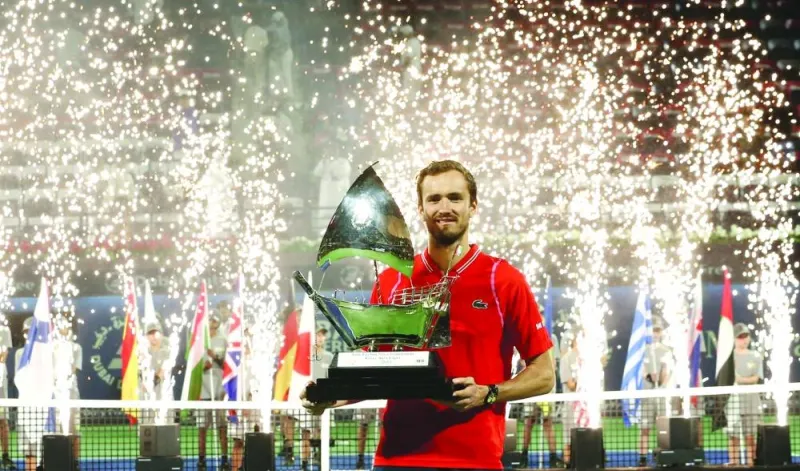 Russia’s Daniil Medvedev poses with trophy after winning the final match against Russia’s Andrey Rublev at the ATP 500 Dubai Tennis Championships. (AFP)
