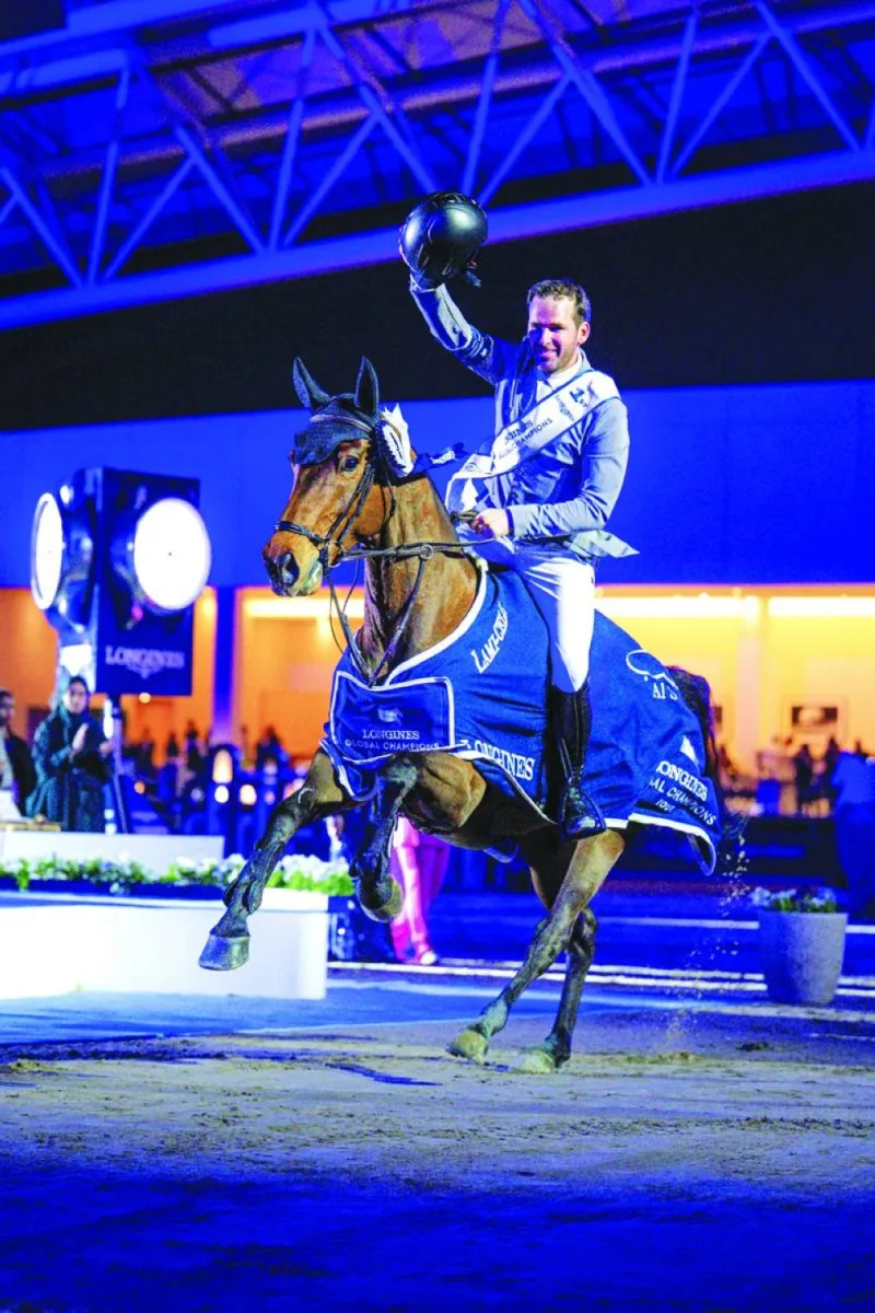 Philipp Weishaupt celebrates with his nine-year-old mare Just Be Gentle after the Longines Global Champions Tour Grand Prix of Doha win.