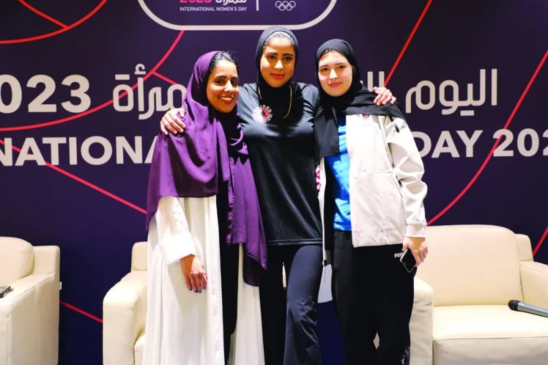 Qatar’s fencer Lina al-Buainain, 400m hurdler Mariam Fareed and Wyld Gym founder Haya Burshaid pose after the panel discussion during the women’s day event held by the Qatar Olympic Committee at Al Shaqab yesterday.