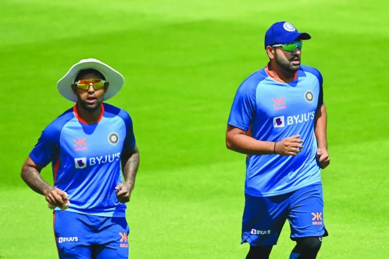 India’s team captain Rohit Sharma (right) and teammate Suryakumar Yadav warm up during a training session in Ahmedabad ahead of their fourth and final Test against Australia. (AFP) 
