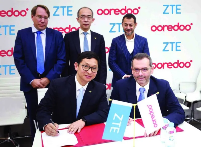 Ooredoo and ZTE officials during the signing ceremony.