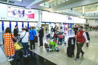 Travellers at the arrivals hall at Hong Kong International Airport. After being confined indoors for nearly two years, many travellers around the world are now booking more trips than they did before the coronavirus era, to make up for lost time and reconnect with friends and family.