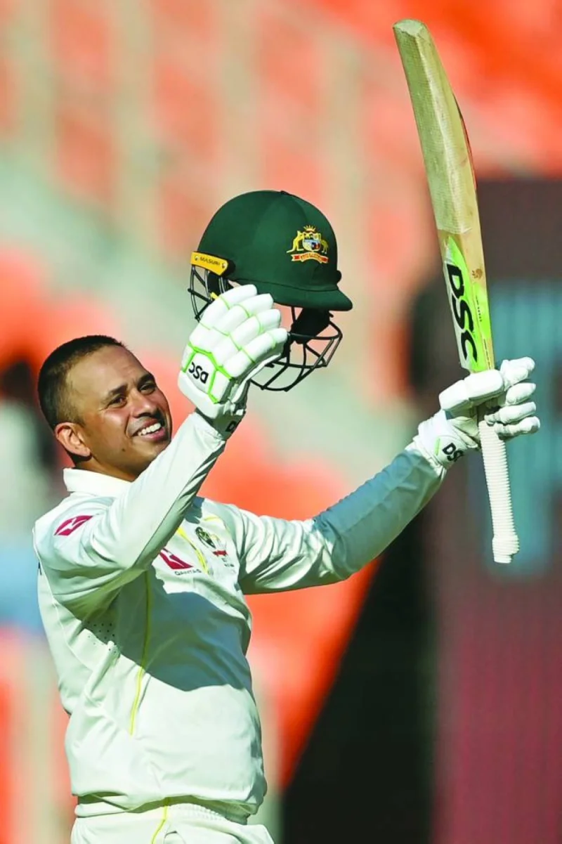 Australia’s Usman Khawaja celebrates after scoring a hundred during the first day of the fourth and final Test against India in Ahmedabad yesterday. (AFP)