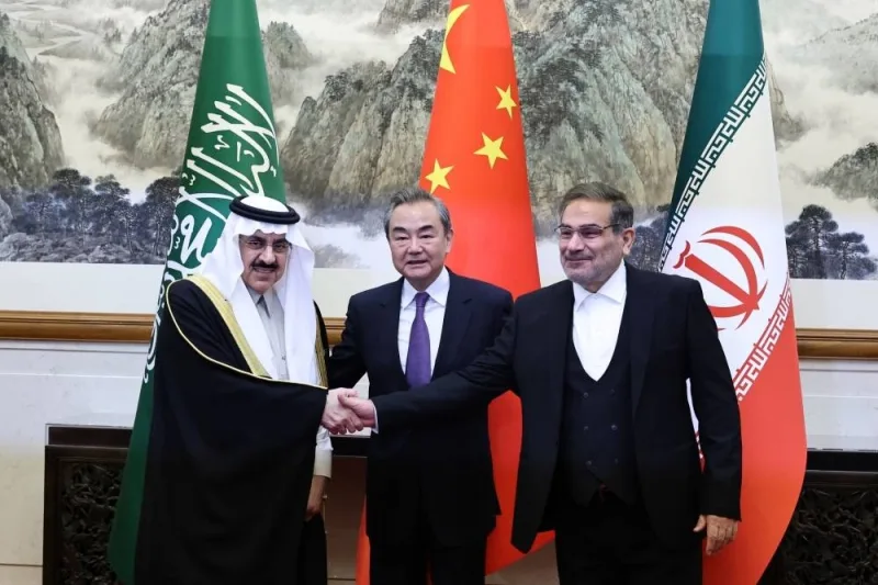 Wang Yi, a member of the Political Bureau of the Communist Party of China (CPC) Central Committee and director of the Office of the Central Foreign Affairs Commission, Ali Shamkhani, the secretary of Iran’s Supreme National Security Council, and Minister of State and national security adviser of Saudi Arabia Musaad bin Mohammed al-Aiban pose for pictures during a meeting in Beijing, China Friday.