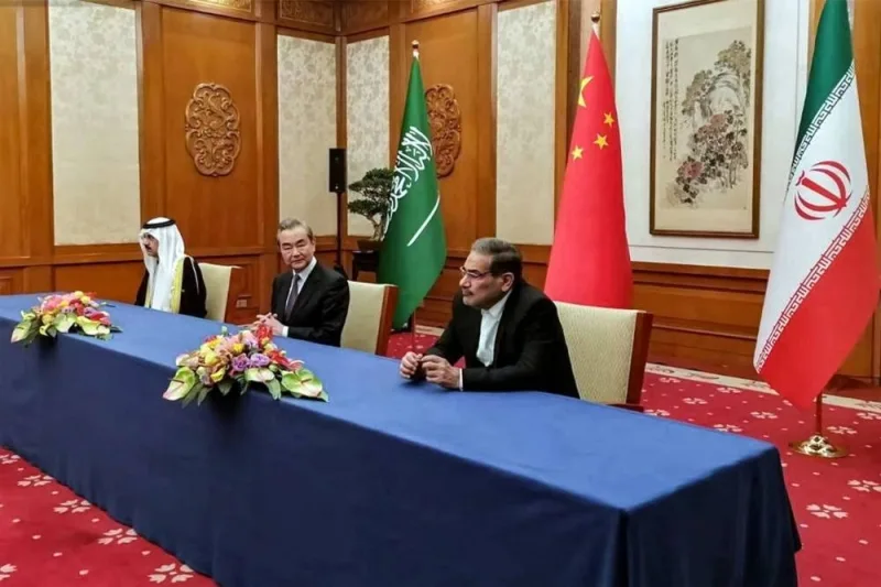 The Secretary of the Supreme National Security Council of Iran Ali Shamkhani (R), the Director of the Office of the Central Foreign Affairs Commission of the Chinese Communist Party (CCP) Wang Yi (C), and Saudi Arabia&#039;s National Security adviser and Minister of State Musaad bin Mohammed al-Aiban (L) meeting together in Beijing on Friday. AFP