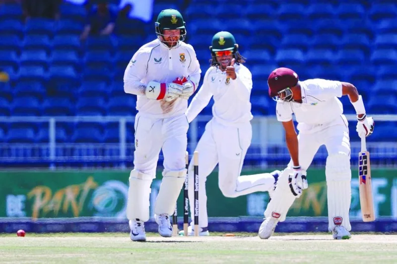 West Indies’ Roston Chase (right) looks on after being bowled by South Africa’s Keshav Maharaj (not seen) as South Africa’s Tony de Zorzi (centre) and wicketkeeper Heinrich Klaasen celebrate during the second Test at The Wanderers Stadium in Johannesburg. (AFP)