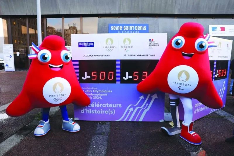 Performers dressed as the event mascots The Phryges pose during the unveiling of a digital countdown panel 500 days ahead of the Paris 2024 Olympics and Paralympic Games in Bobigny, a suburb of Paris, yesterday. (AFP)