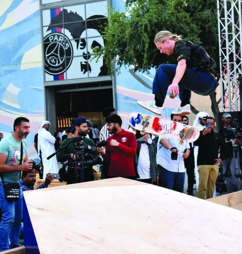 A skateboarder performs a stunt at the event.