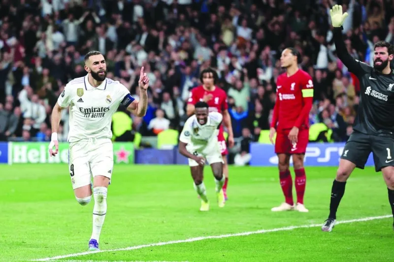 Real Madrid’s Karim Benzema celebrates after scoring against Liverpool. (AFP)