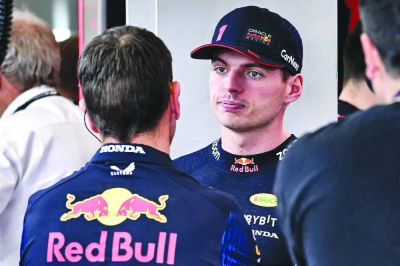 Red Bull Racing’s Dutch driver Max Verstappen chats with a mechanic during the first practice session at the Jeddah Corniche Circuit yesterday. (AFP)