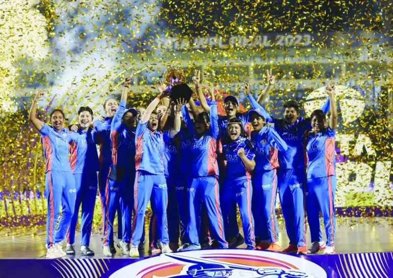 Mumbai Indians’ players celebrate as they lift the Women’s Premier League (WPL) trophy. (Reuters)
