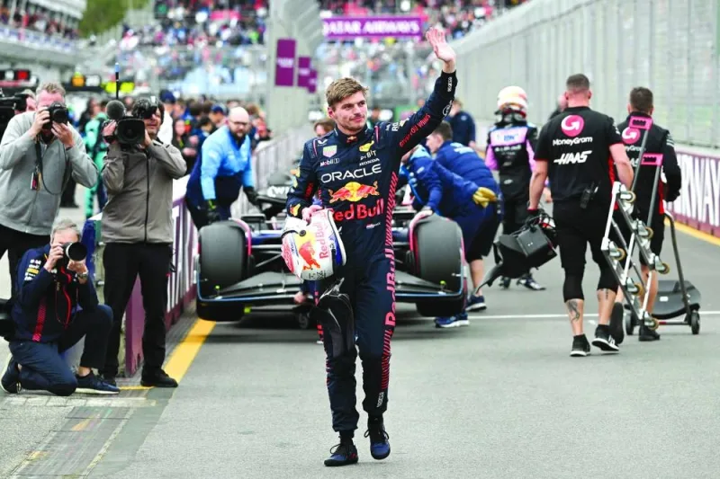 Red Bull Racing’s Dutch driver Max Verstappen celebrates after taking pole position following the qualifying session of the Australian Grand Prix at the Albert Park Circuit in Melbourne on Saturday. (AFP)