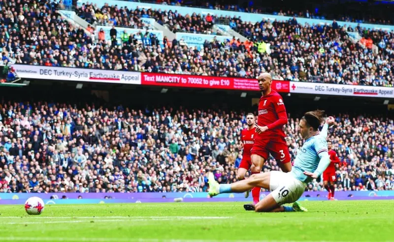 Manchester City’s Jack Grealish (right) scores against Liverpool during the Premier League match on Saturday. (Reuters)