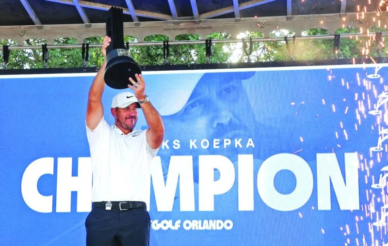 Brooks Koepka celebrates with the trophy after winning the LIV Golf Invitational – Orlando. (AFP)