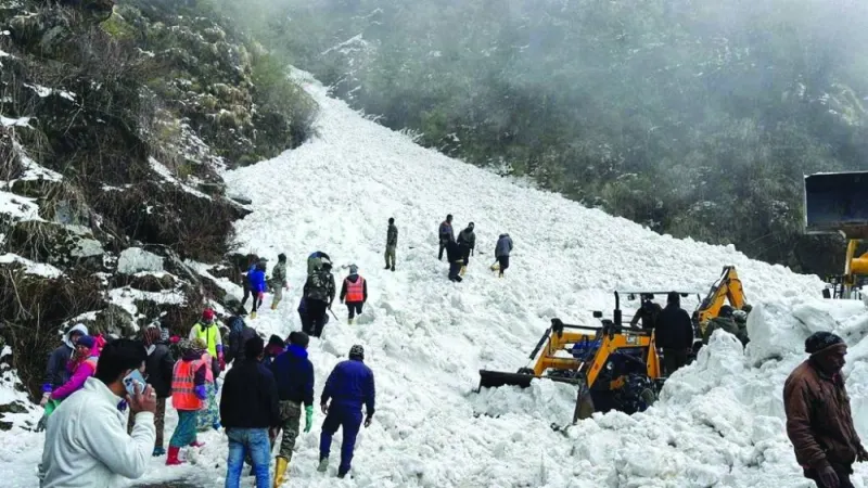 Rescue team members search for survivors after an avalanche in the northeastern state of Sikkim, India, yesterday.