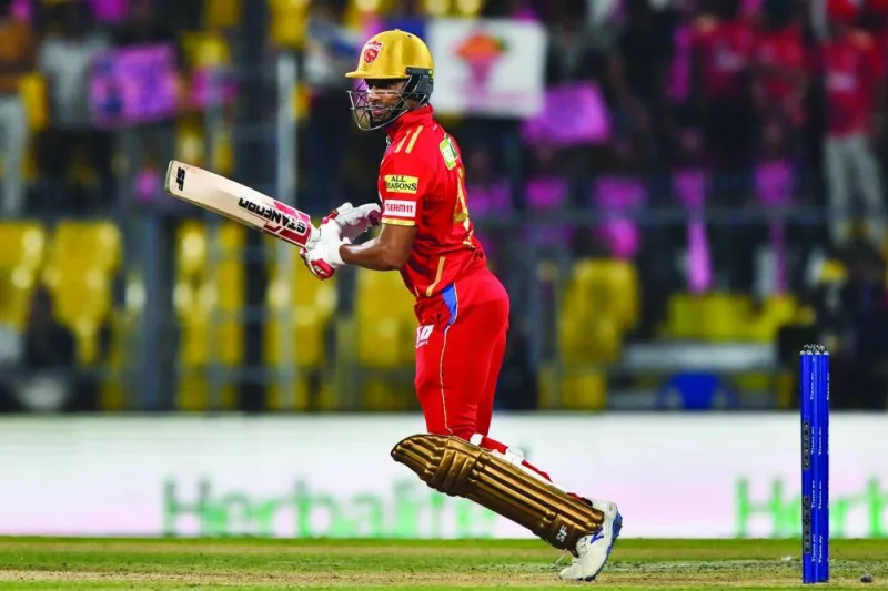 Punjab Kings captain Shikhar Dhawan plays a shot during the Indian Premier League Twenty20 match against Rajasthan Royals at the Assam Cricket Association Stadium in Guwahati yesterday. (AFP) 