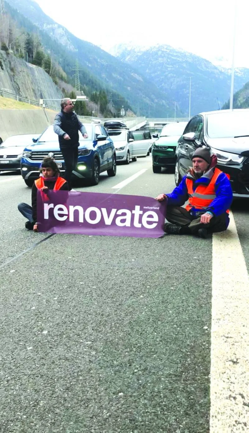 Climate activists take part in a Renovate Switzerland protest on the A2 (Gotthard Motorway) in Switzerland. (Reuters)