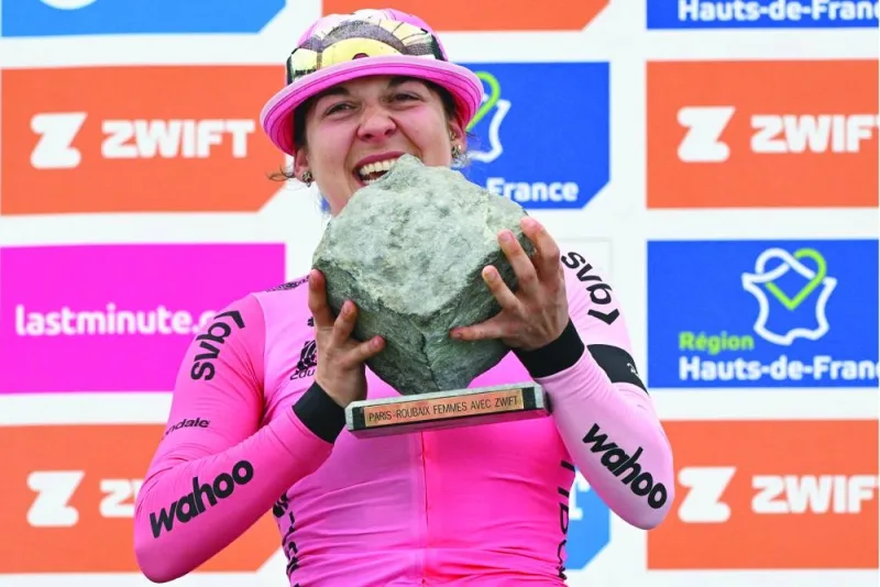 EF Education-TIBCO-SVB team’s Canadian rider Alison Jackson celebrates on the podium after winning the third edition of the Paris-Roubaix one-day classic cycling race, between Denain and Roubaix, on Saturday. (AFP)