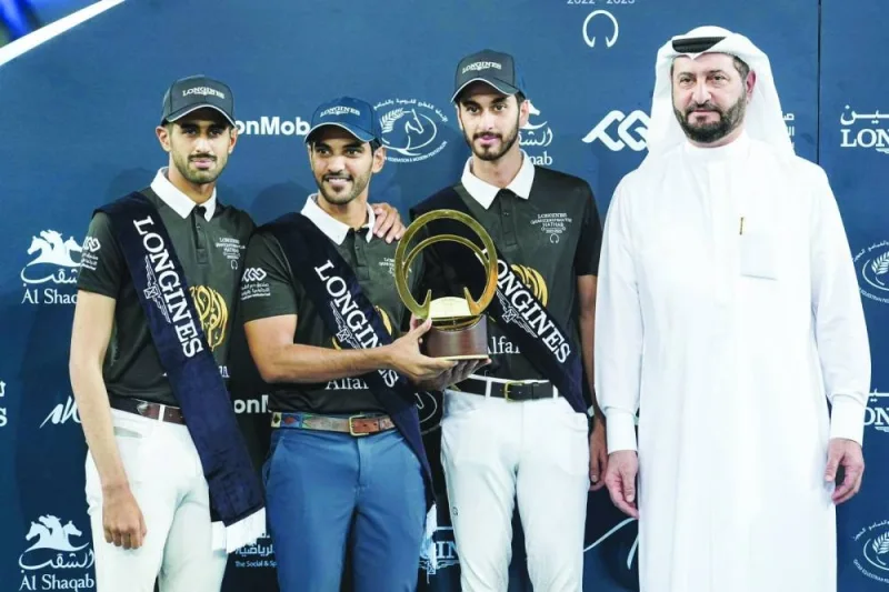 Members of the Alfardan team which won the Medium Tour Team Title pose with team owner Fahad Hussain Alfardan.