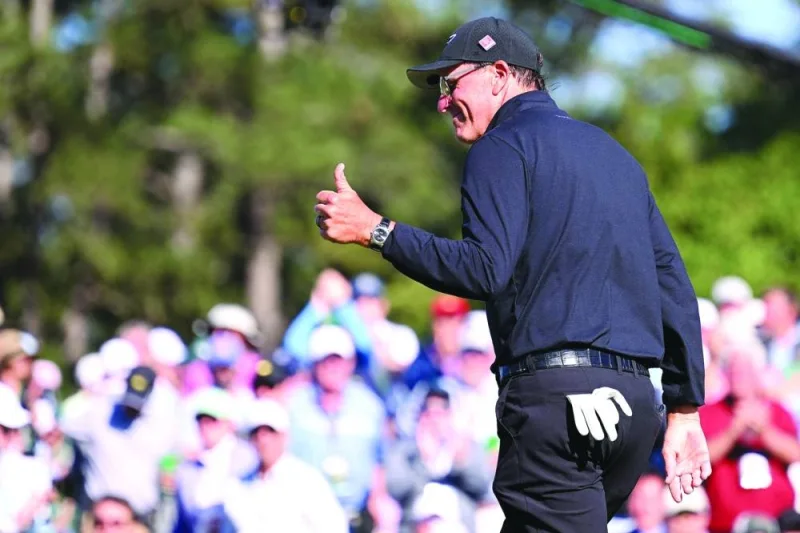Phil Mickelson of the US reacts to his birdie putt on the 18th green during the final round of the 2023 Masters in Augusta, Georgia. (AFP)