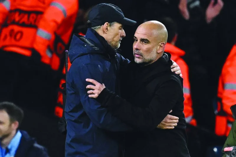 Bayern Munich’s head coach Thomas Tuchel (left) and Manchester City’s manager Pep Guardiola embrace after the Champions League first leg quarter-final. (AFP)