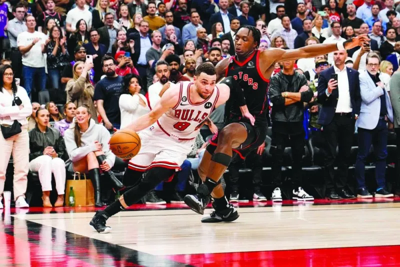 Zach LaVine of the Chicago Bulls drives past OG Anunoby of the Toronto Raptors during the 2023 Play-In Tournament at the Scotiabank Arena in Toronto. (AFP)