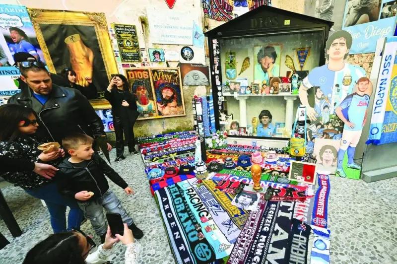 In this file photo taken on March 24, 2023 scarves and paraphernalia dedicated to the SSC Napoli club and to 
Argentinian football legend Diego Maradona are displayed in the Quartieri Spagnoli district of Naples. (AFP)