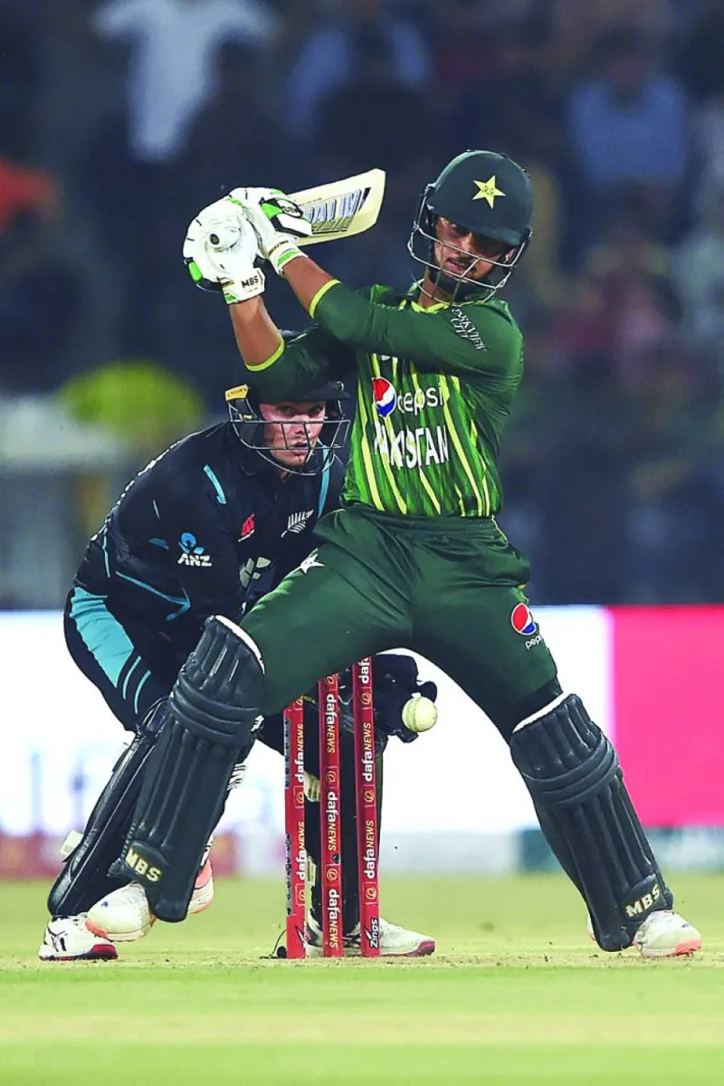 Pakistan’s Saim Ayub (right) plays a shot as New Zealand’s wicketkeeper captain Tom Latham watches during their first Twenty20 international in Lahore on Friday. (AFP)