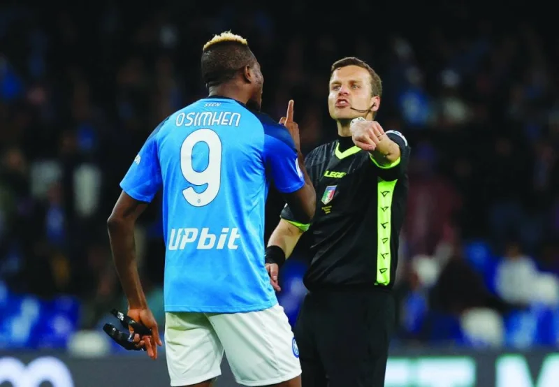 Napoli’s Victor Osimhen remonstrates with referee Federico La Penna during the Serie A match against Hellas Verona. (Reuters)