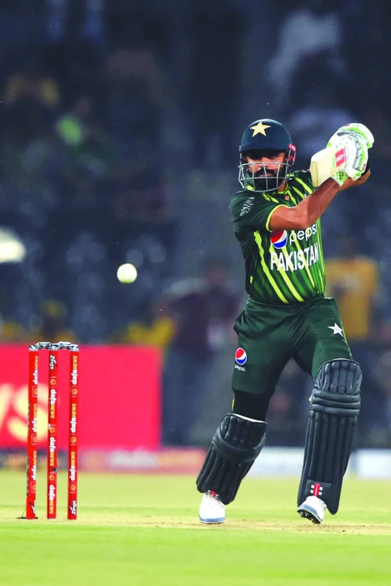 Pakistan’s captain Babar Azam plays a shot during the second Twenty20I against New Zealand in Lahore on Saturday. (AFP)