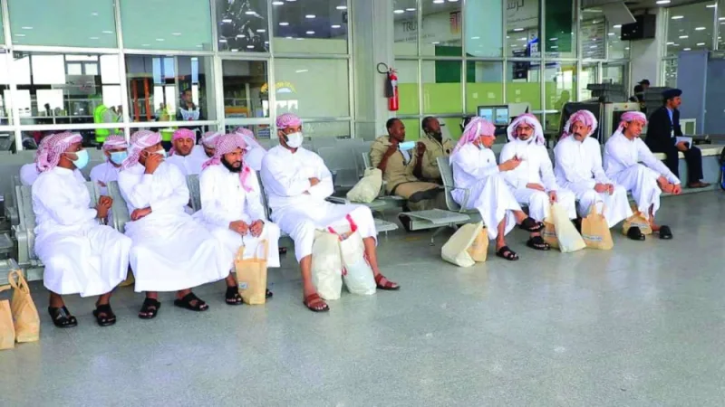 This handout image provided yesterday, shows prisoners, take a seat at Sanaa airport ahead of boarding their flight to the Saudi city of Abha.